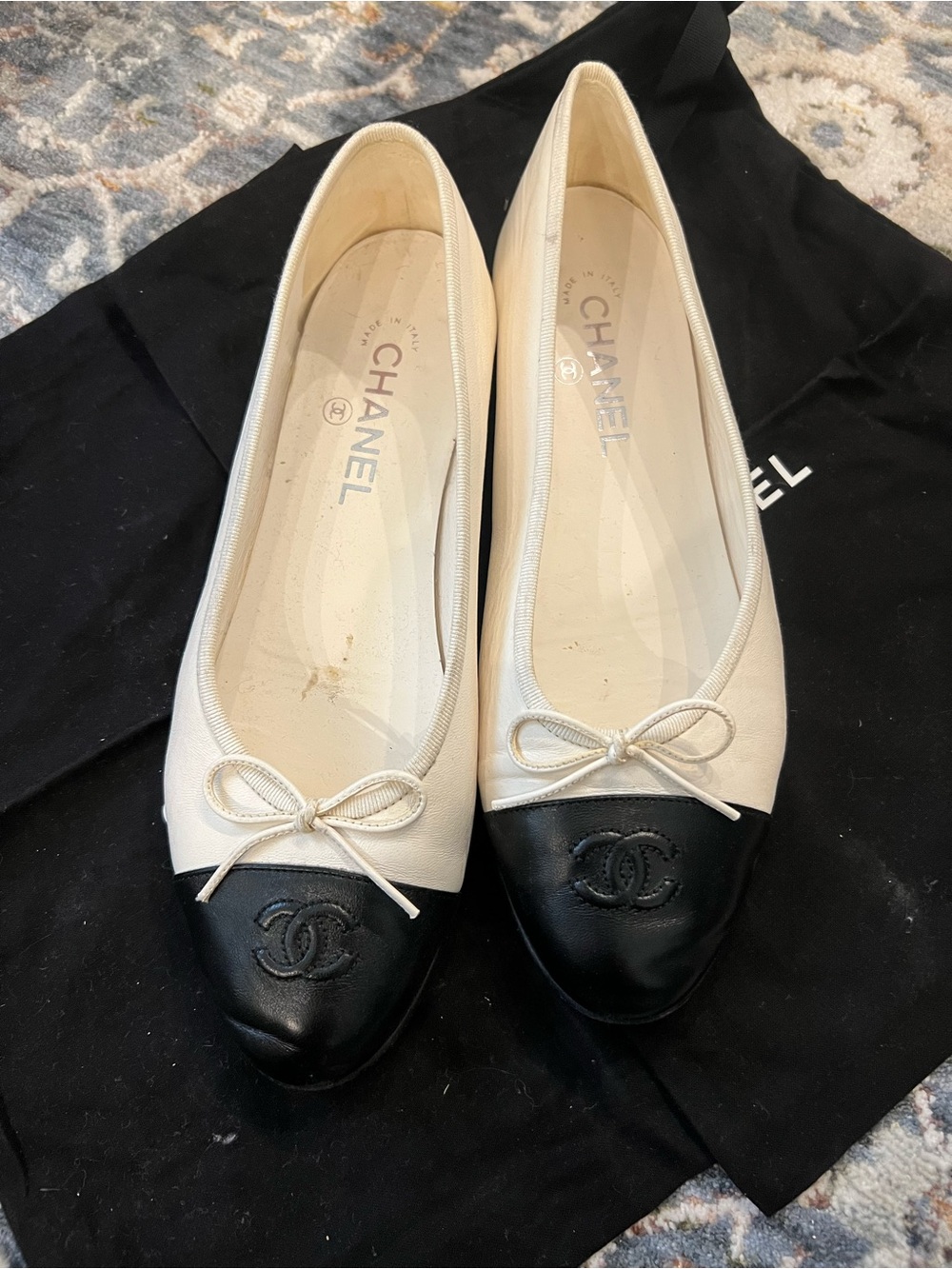CHANEL Two-Tone Ivory and Black Cap-Toe Ballet Flats